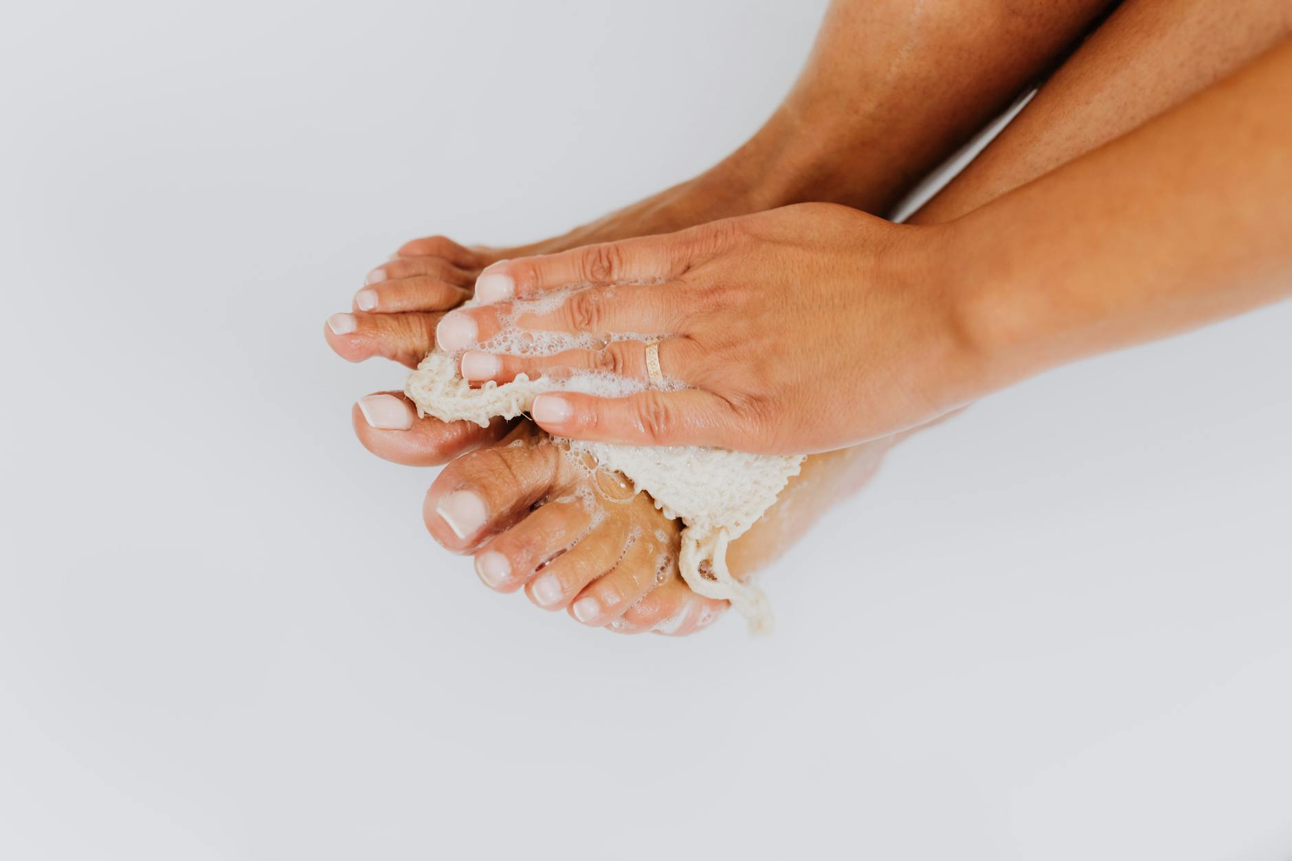 a woman washing her feet